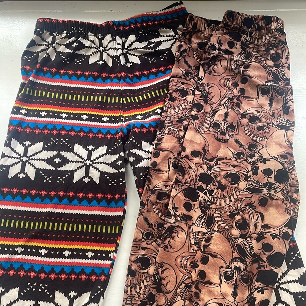Two pairs Agnes & Dora S/M adult leggings fit US sizes 4-12. Near new condition